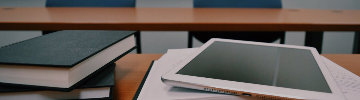 tablet on a stack of books